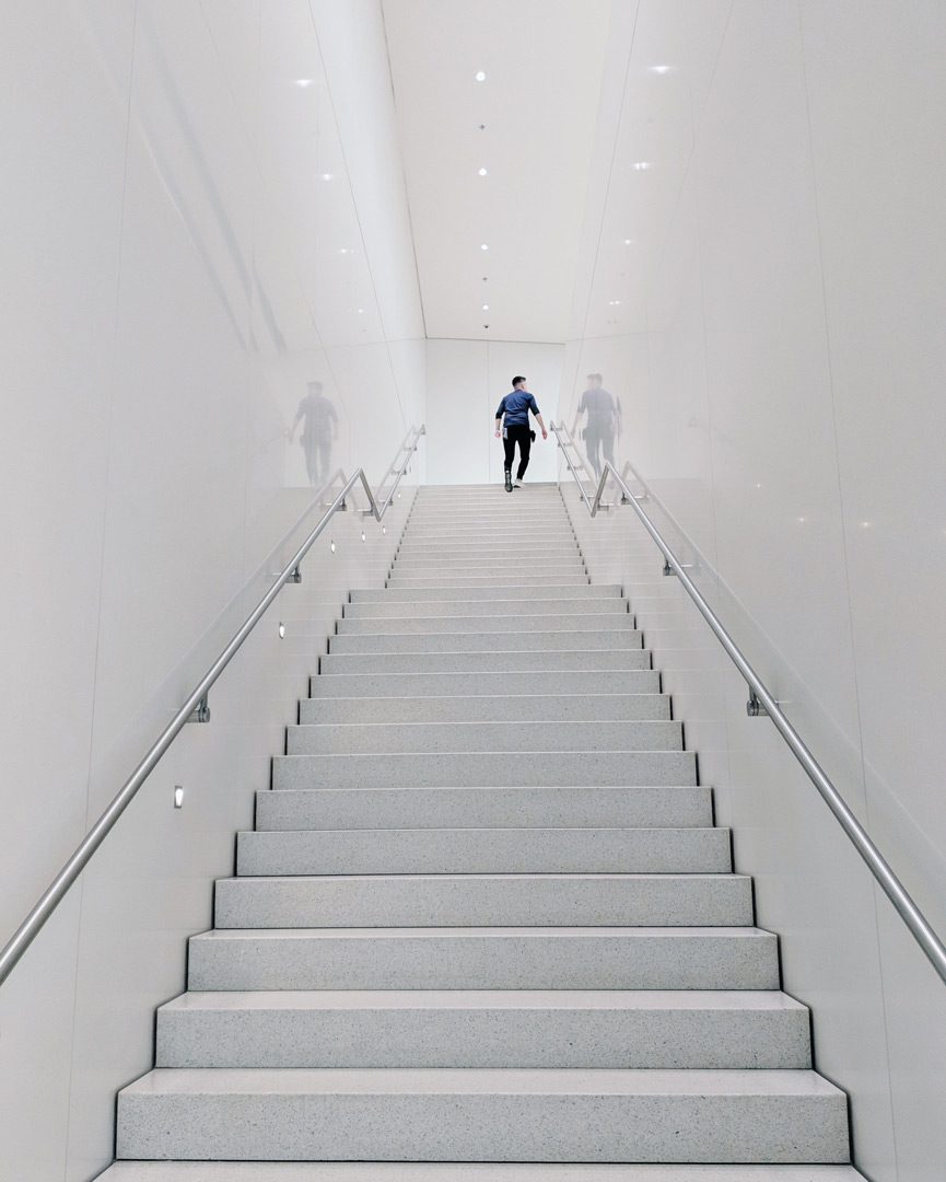 image of a person at the top of stairs